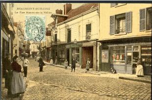 carte postale ancienne couleur beaumont sur oise rue haute de la vallée commerce et animée